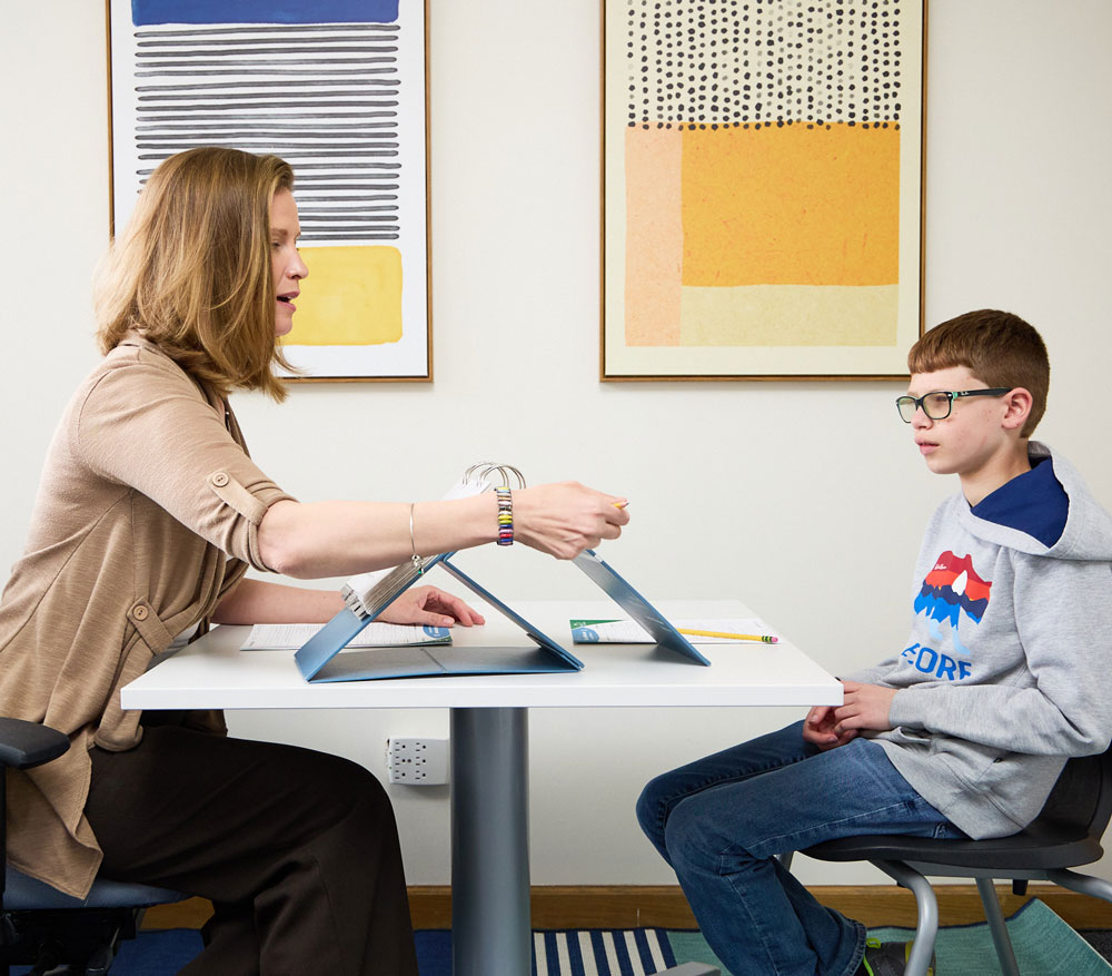 Dr. Costello performs a learning evaluation with a young boy at the Learning Evaluation Center in Littleton, Colorado