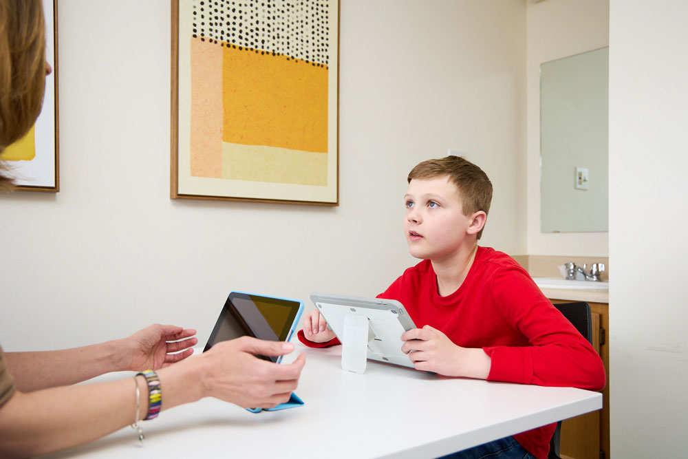 Dr. C performs a learning evaluation with a young boy at the Learning Evaluation Center in Littleton, Colorado